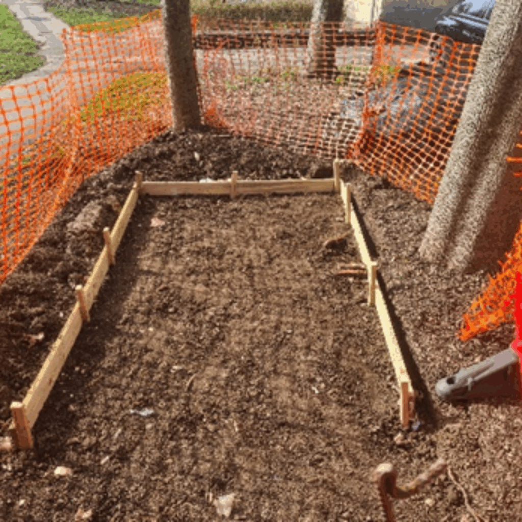 Global Gardening Volunteers prepared area with wooden boarder