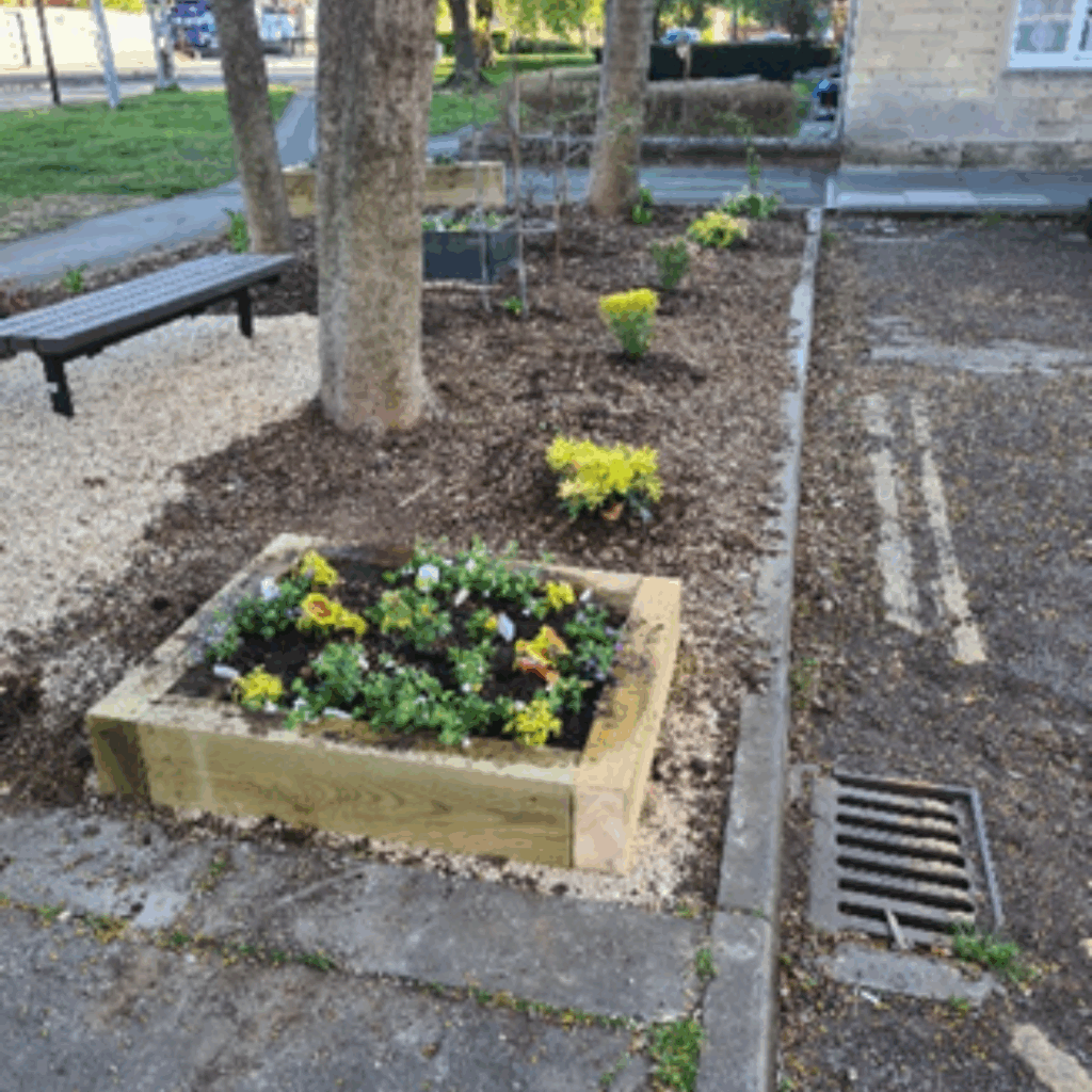 Global Gardening Volunteers raised wooden flowerbed