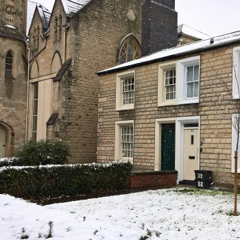 The cottage at 34 Faringdon Road sits among a sheet of snow.